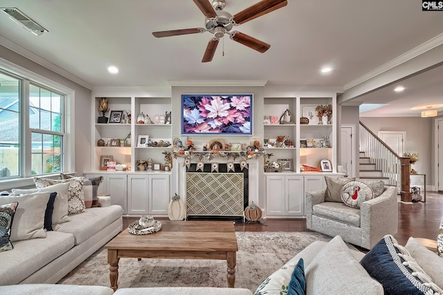 living room featuring light hardwood / wood-style floors, ceiling fan, and crown molding