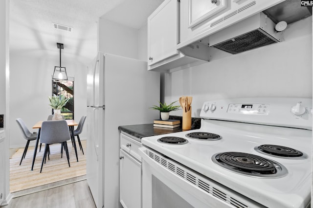 kitchen with white cabinetry, premium range hood, pendant lighting, light hardwood / wood-style floors, and white appliances