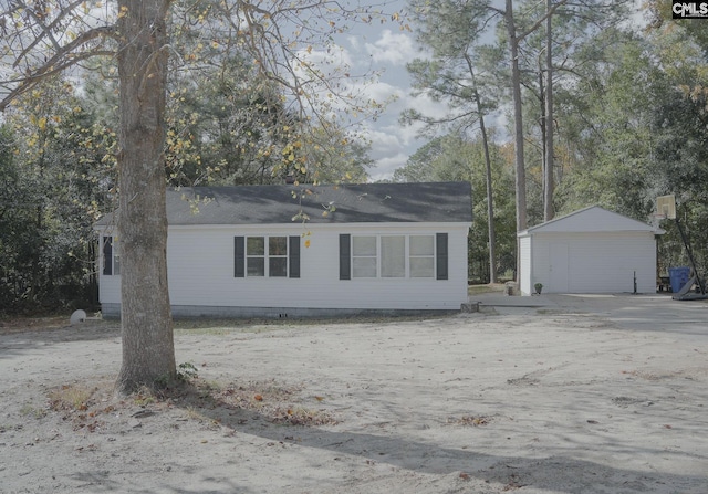 exterior space with a garage and an outdoor structure