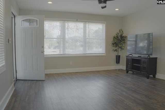 interior space featuring ceiling fan and dark hardwood / wood-style flooring