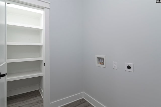 clothes washing area featuring electric dryer hookup, hookup for a washing machine, and dark hardwood / wood-style floors