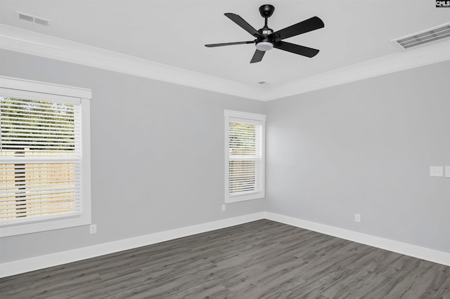 unfurnished room featuring ornamental molding, dark wood-type flooring, and ceiling fan