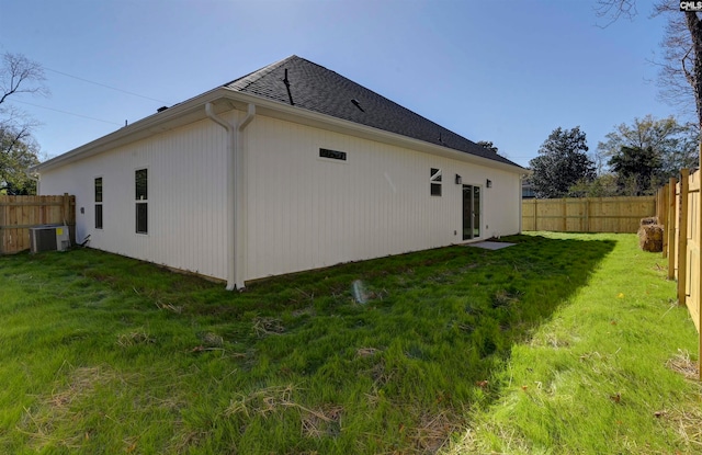 view of home's exterior featuring central AC and a lawn