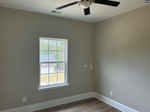 spare room featuring ceiling fan and hardwood / wood-style floors