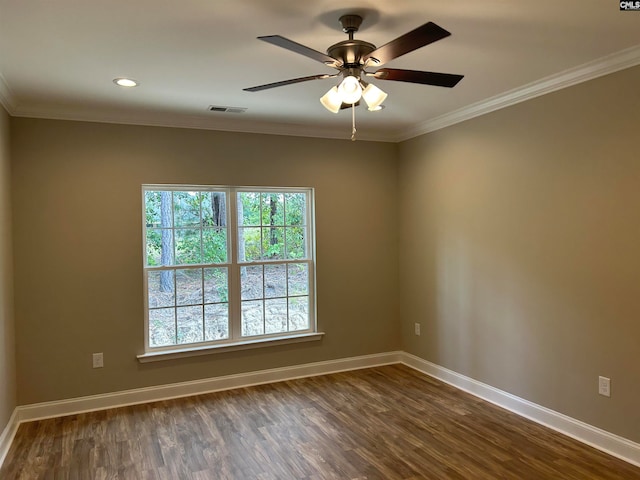 empty room featuring ceiling fan, dark hardwood / wood-style flooring, and ornamental molding