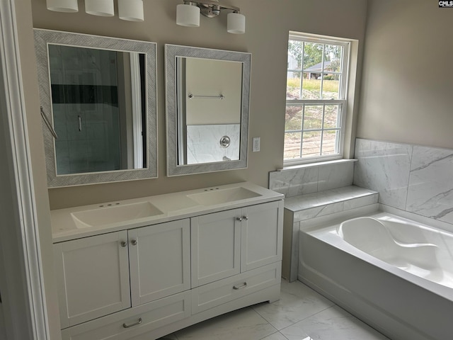 bathroom with vanity and a tub