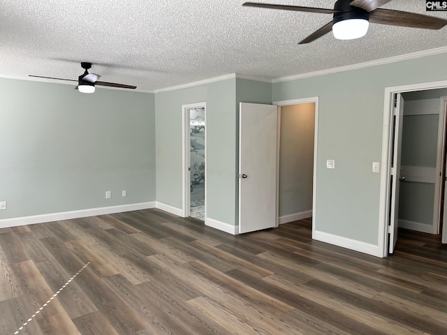 unfurnished bedroom featuring ceiling fan, dark hardwood / wood-style floors, and ensuite bath