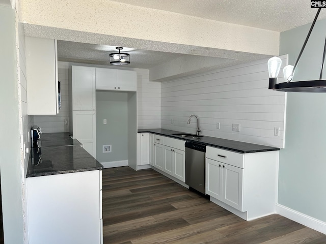 kitchen with white cabinets, dark hardwood / wood-style flooring, dishwasher, and sink