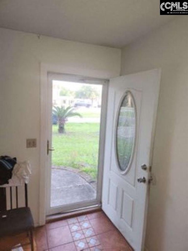 entrance foyer with light tile patterned floors