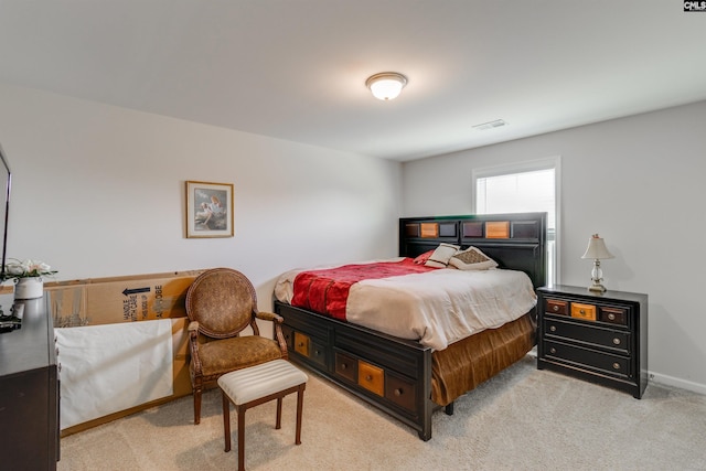 bedroom featuring light carpet