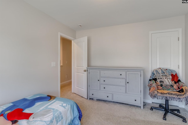 bedroom featuring light carpet