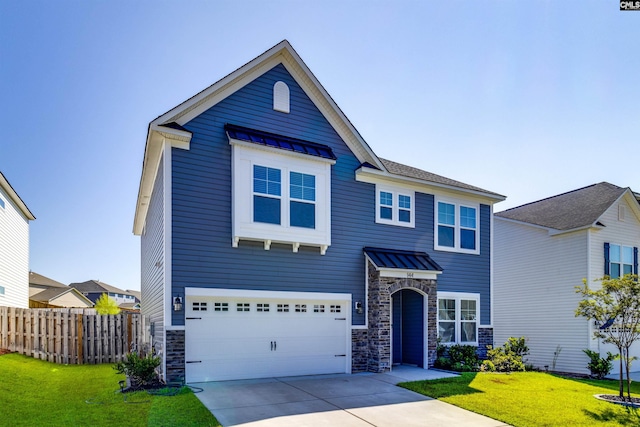 view of front of property featuring a front lawn and a garage