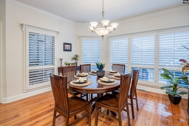 dining space featuring a chandelier, light hardwood / wood-style floors, and a wealth of natural light