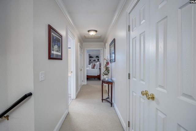 corridor featuring crown molding and light colored carpet