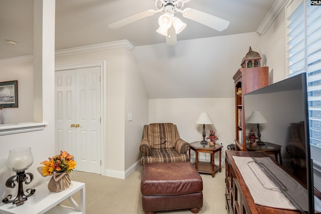 living area with crown molding, light colored carpet, ceiling fan, and vaulted ceiling