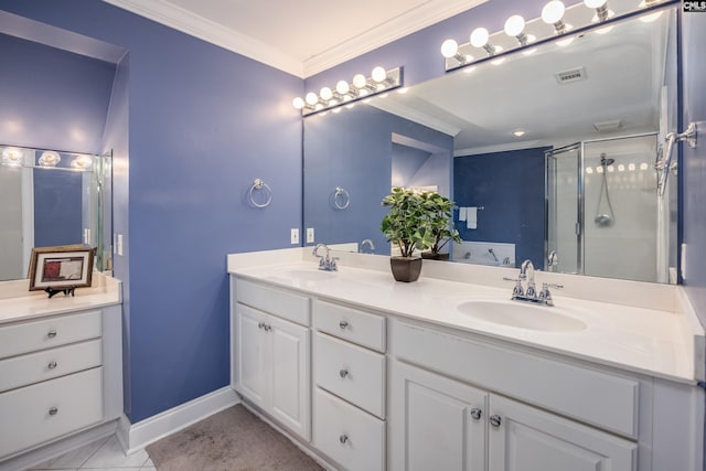 bathroom with tile patterned floors, ornamental molding, an enclosed shower, and vanity