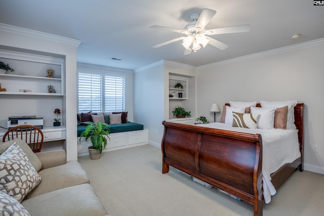 carpeted bedroom featuring ornamental molding and ceiling fan