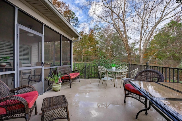 view of patio with a sunroom