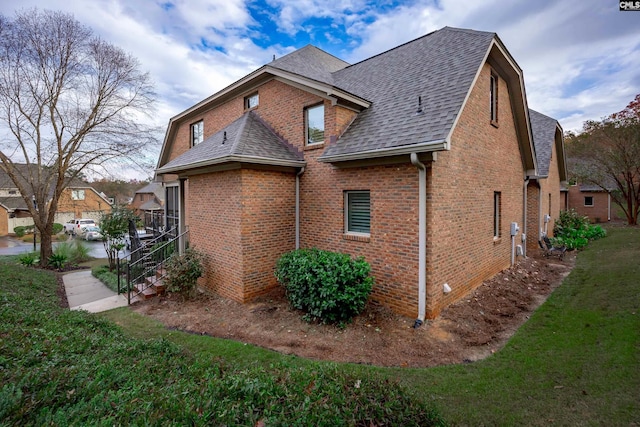 view of property exterior featuring a lawn