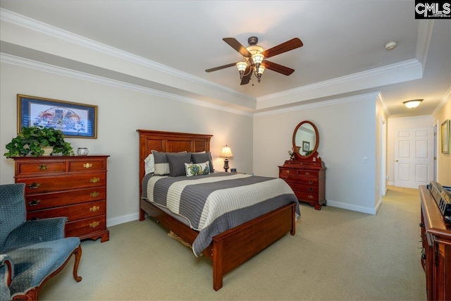 carpeted bedroom with crown molding, a raised ceiling, and ceiling fan