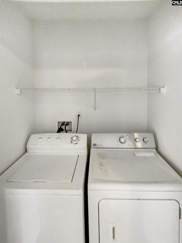 laundry room featuring separate washer and dryer