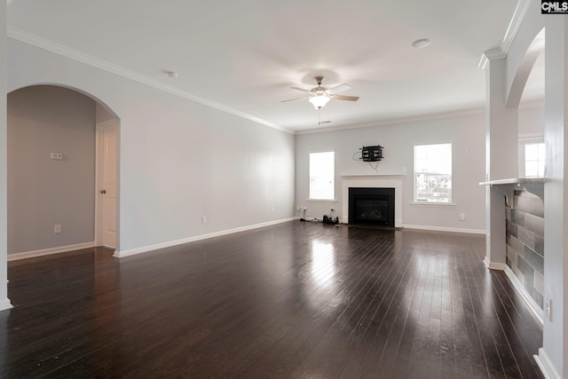 unfurnished living room featuring dark hardwood / wood-style floors, ceiling fan, and ornamental molding