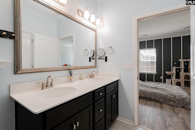 bathroom with vanity and wood-type flooring