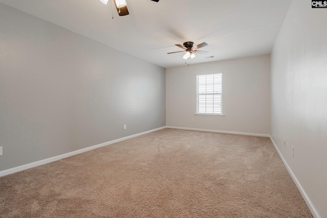 unfurnished room featuring ceiling fan and carpet floors