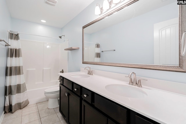 full bathroom featuring tile patterned flooring, vanity, toilet, and shower / tub combo