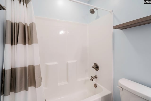 bathroom featuring toilet and shower / bathtub combination with curtain