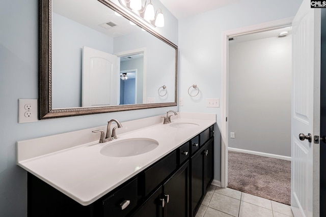 bathroom with tile patterned flooring and vanity