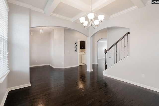 interior space with dark wood-type flooring, beamed ceiling, a notable chandelier, crown molding, and washer and clothes dryer