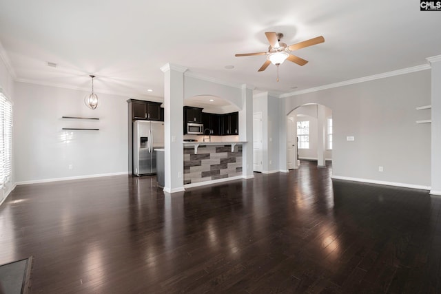 living room featuring ceiling fan, dark hardwood / wood-style flooring, and ornamental molding