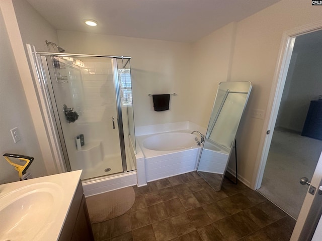 bathroom featuring tile patterned floors, vanity, and independent shower and bath