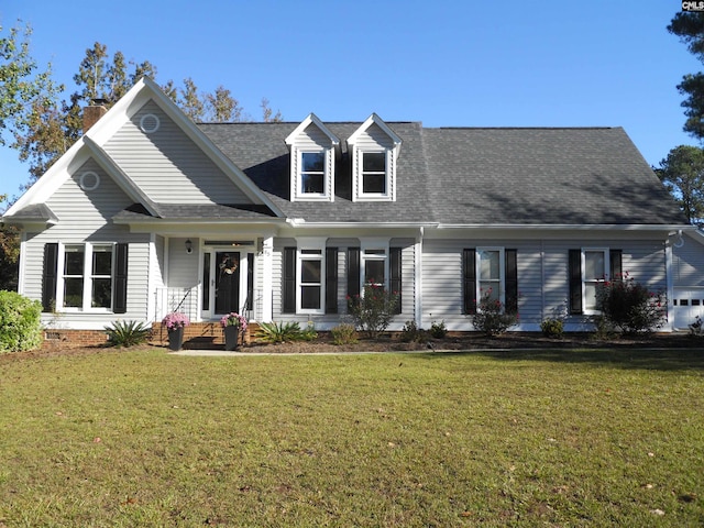 cape cod house featuring a front lawn