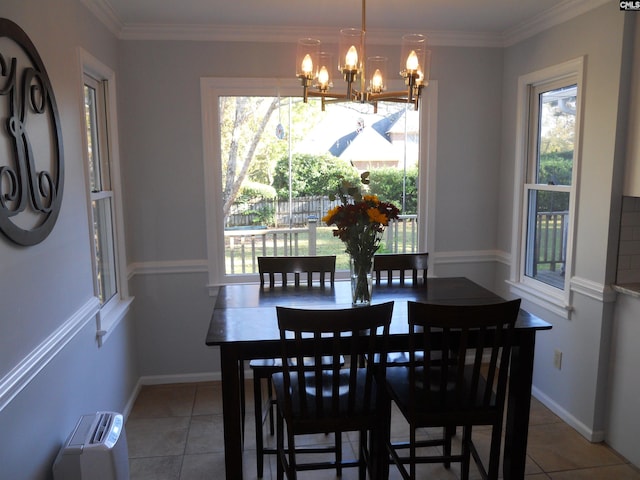 dining area with a notable chandelier, plenty of natural light, and tile patterned flooring