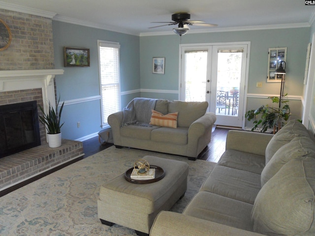 living room featuring hardwood / wood-style floors, french doors, a healthy amount of sunlight, and ceiling fan