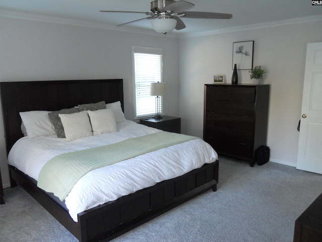 bedroom with ceiling fan, crown molding, and light carpet