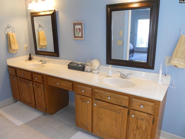 bathroom with tile patterned flooring and vanity