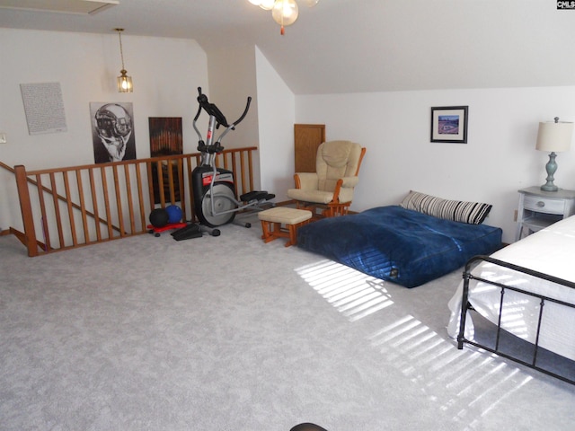 bedroom featuring lofted ceiling and carpet floors