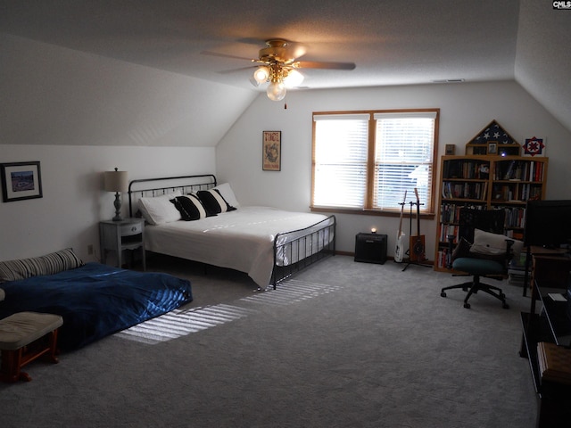 bedroom with carpet flooring, a textured ceiling, ceiling fan, and lofted ceiling