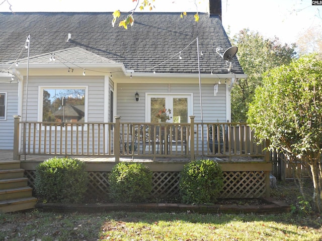 back of property featuring a wooden deck