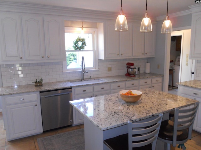 kitchen with white cabinetry, dishwasher, and a center island