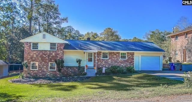 view of front of home featuring a garage and a front lawn