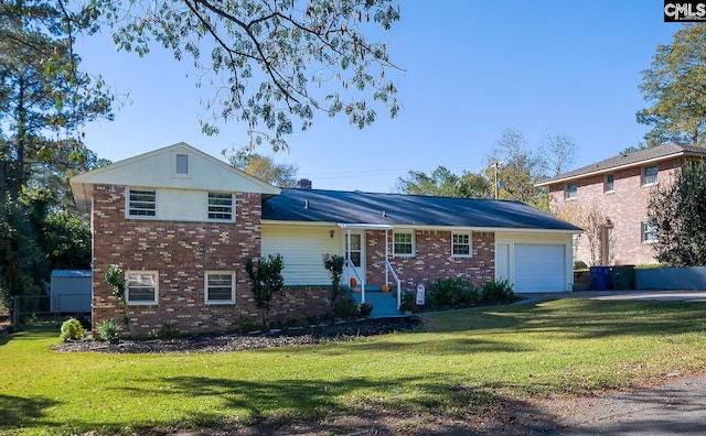 split level home featuring a front yard and a garage