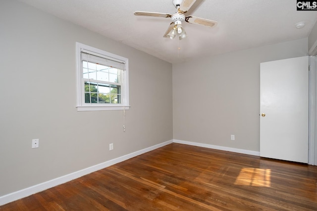 unfurnished room with ceiling fan, dark hardwood / wood-style flooring, and a textured ceiling