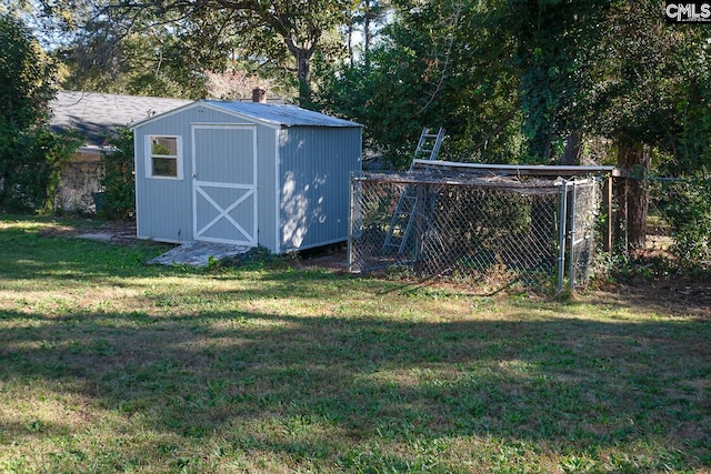 view of outbuilding featuring a lawn