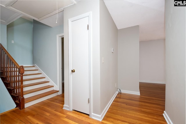 hallway with light hardwood / wood-style floors