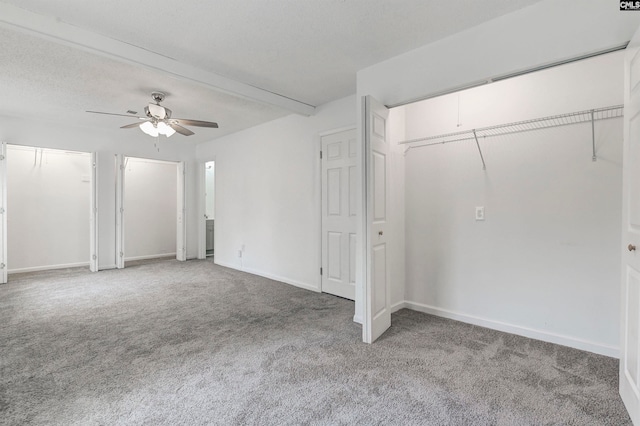 interior space with ceiling fan and a textured ceiling