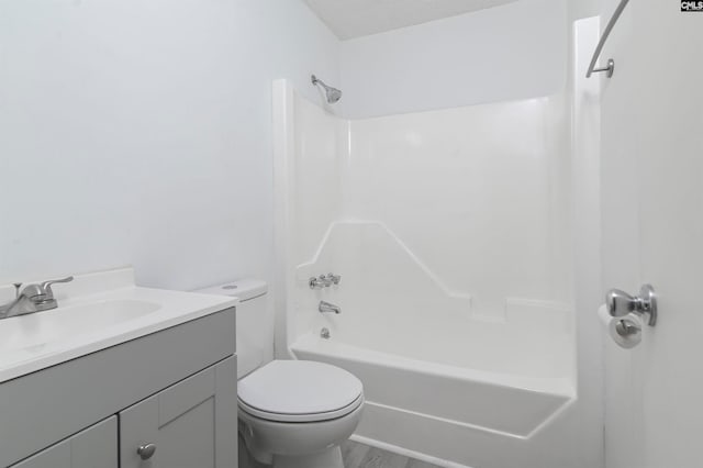 full bathroom featuring vanity,  shower combination, and toilet